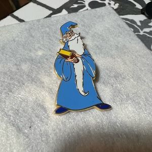 Merlin holding a book disney pin